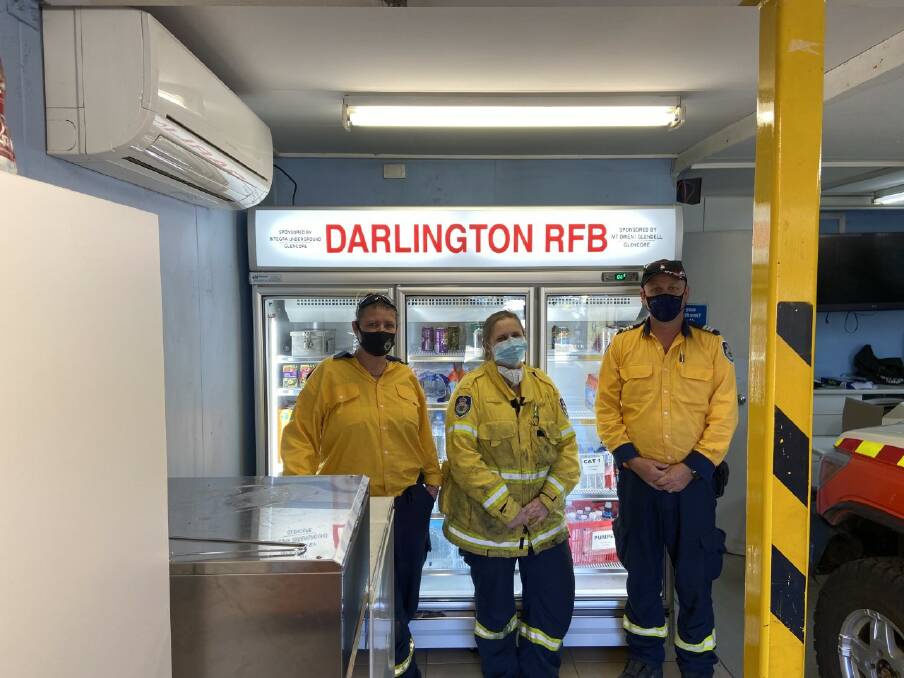 KEEPING COOL: Members of the Darlington RFS - Fire fighter Jo Smith fire fighter Kath Hoskins and Captain Micheal Stemmer with the new fridge. Photo supplied.