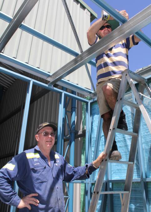 SUPPORT: Members of the Singleton Men's Shed hard at work on the Singleton Neighbourhood Centre's Open Door Project.