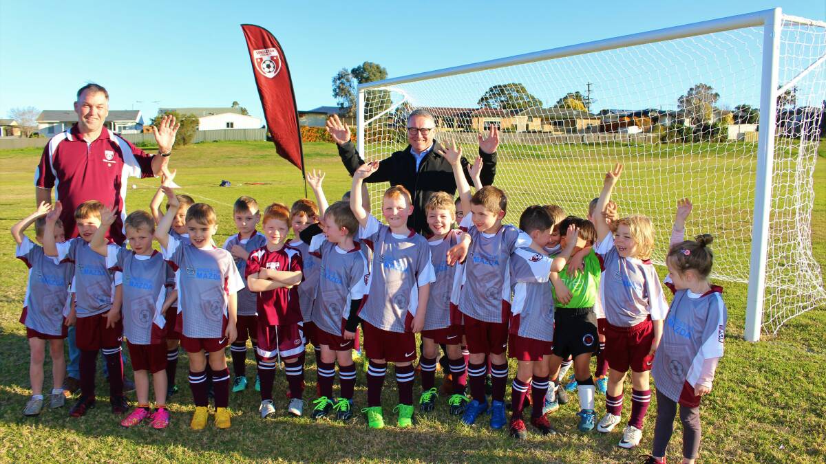 Mark Henderson, Singleton Strikers Chairman and Member for Hunter, Joel Fitzgibbon, at Alroy Oval in Singleton Heights to see the goal posts in action, and watched the under 6 and 7s training.