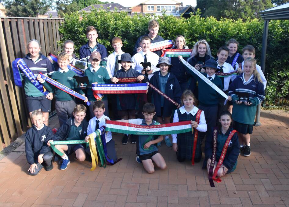 St Catherine's Catholic College, Singleton students and their ag teacher Jo Towers with the trophies and ribbons they won at Wingham Beef Week.