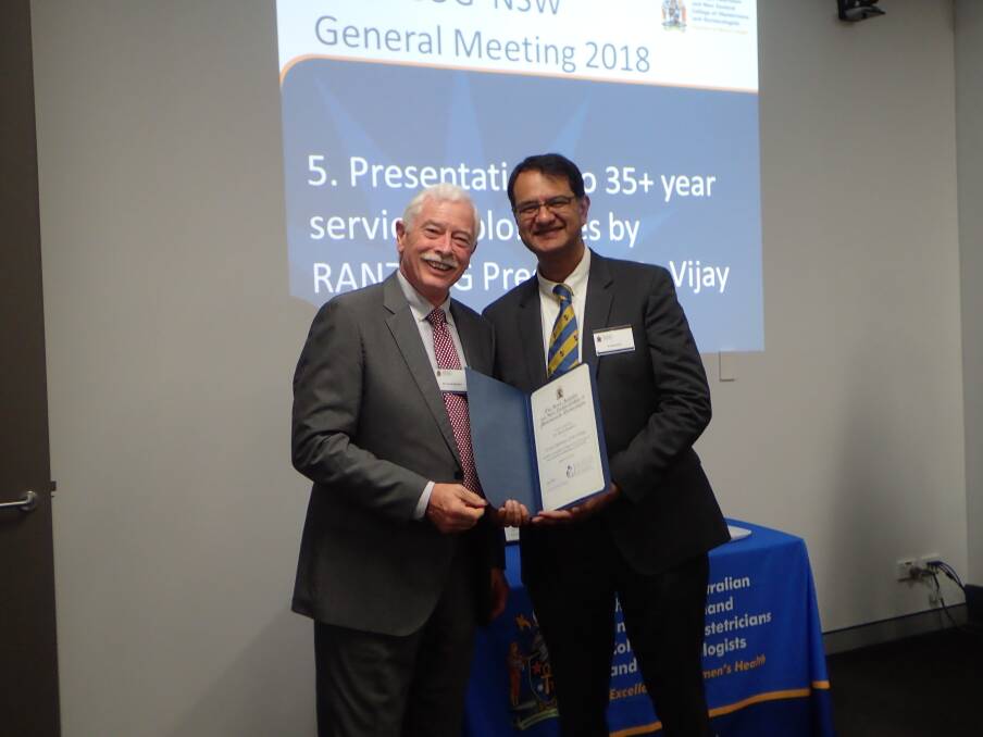 RECOGNITION: David Sanders receives his certificate from Vijay Roach, present of the Royal Australian and New Zealand College of Obstetricians & Gynaecologists.