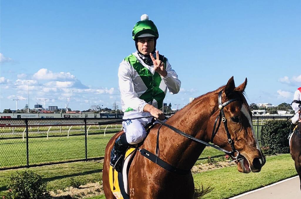 FLYING: Aaron Bullock returns a winner on the Brett Partelle-trained Sacred Sword at Newcastle on August 10. Picture: Newcastle Racecourse 