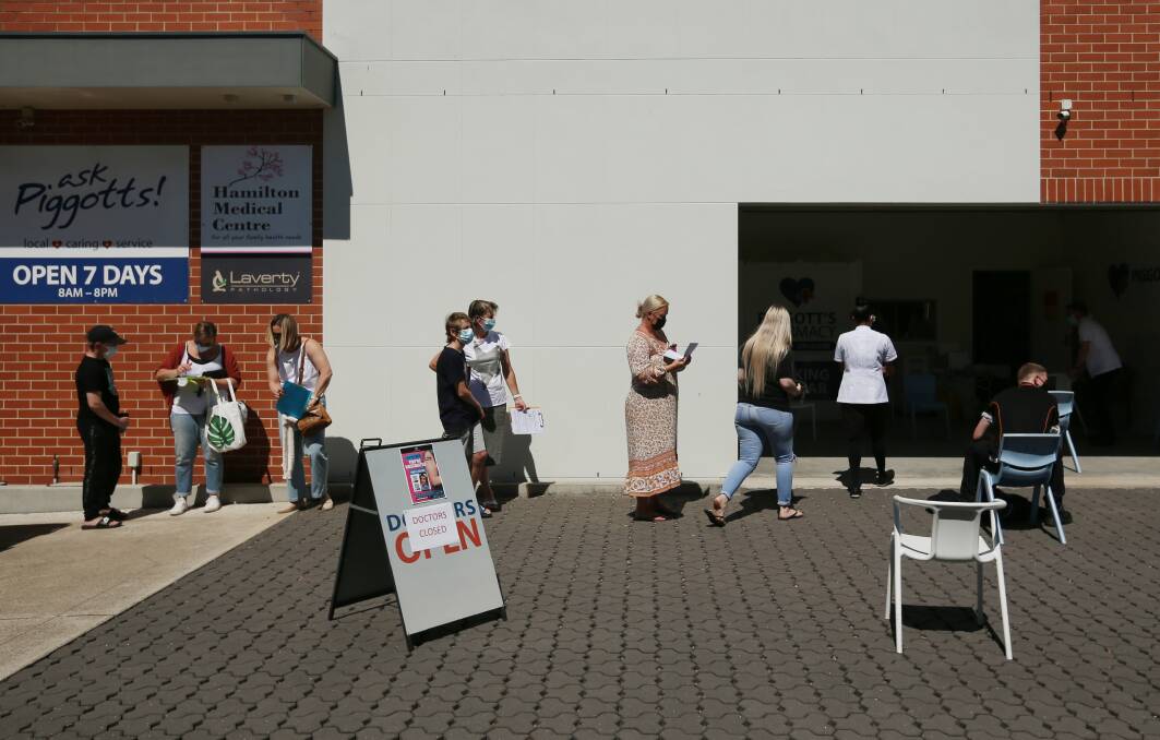 ON THE JAB: People line up for vaccinations in Hamilton. Picture: Simone De Peak