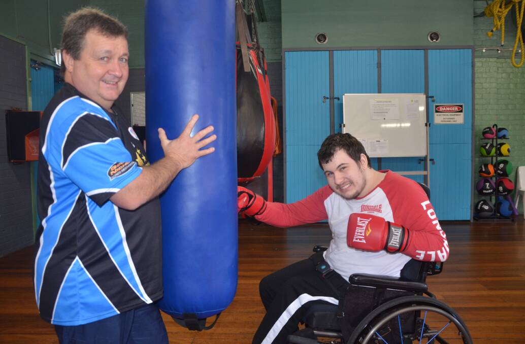 FIGHT CLUB: Zac Lloyd with his boxing coach and Singleton PCYC manager David Andrews.