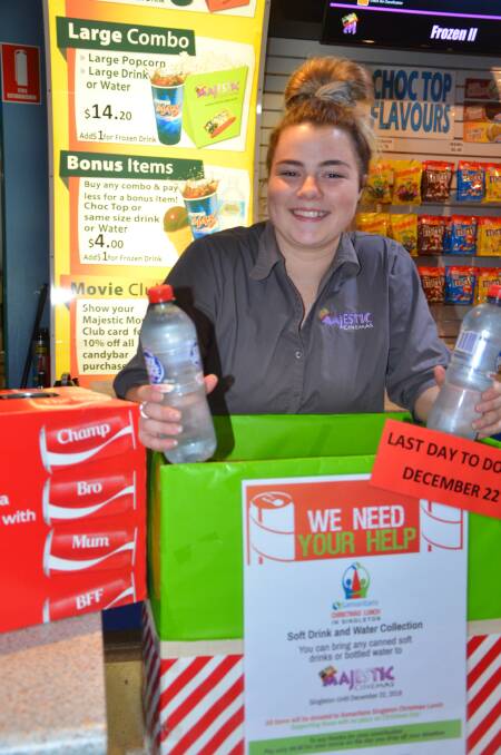 STRONG SUPPORT: Supervisor Sam Mills showcases the Majestic Cinemas Singletons soft drink and water drive, which will help the Samaritans Christmas Lunch in town.