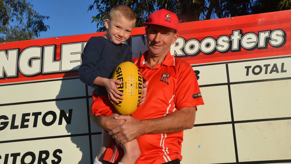GREAT EFFORT DAD: Caydan Jeffriess-Tapper with his father Paul Tapper, who played his 200th match for the Singleton Roosters on Saturday.