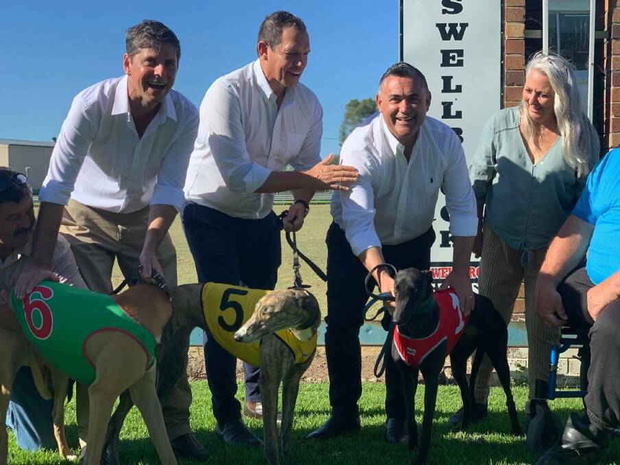 Nationals candidate for Upper Hunter Dave Layzell, Greyhound Racing NSW (GRNSW) CEO Tony Mestrov and Deputy Premier John Barilaro with members of the Muswellbrook community at the Upper Hunter track. 