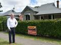 RECORD: Veteran Upper Hunter property agent Peter Dunn outside Singleton's first million-dollar residential property sale, a four-bedroom renovated house in Hunter St, that sold in January. 
