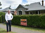 RECORD: Veteran Upper Hunter property agent Peter Dunn outside Singleton's first million-dollar residential property sale, a four-bedroom renovated house in Hunter St, that sold in January. 