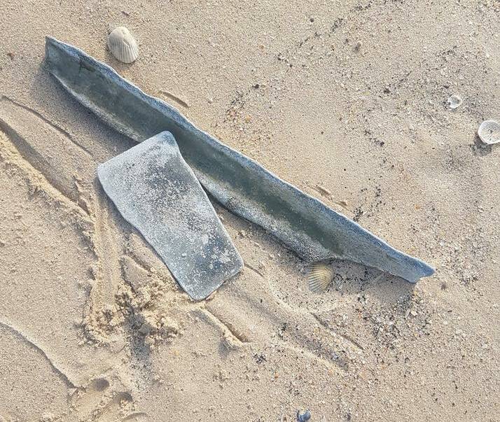 DEADLY: Fragments of asbestos sheeting found scattered along the shoreline at Stockton from The Pines swimming area to the breakwater. Picture: Shannon Hancock