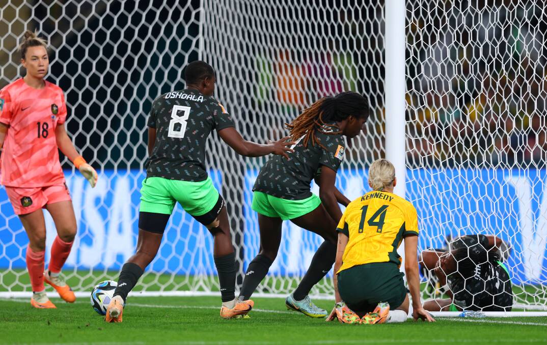 Nigeria's Osinachi Ohale lies on the pitch after scoring her team's second goal at Suncorp Stadium on Thursday night. Picture Getty Images