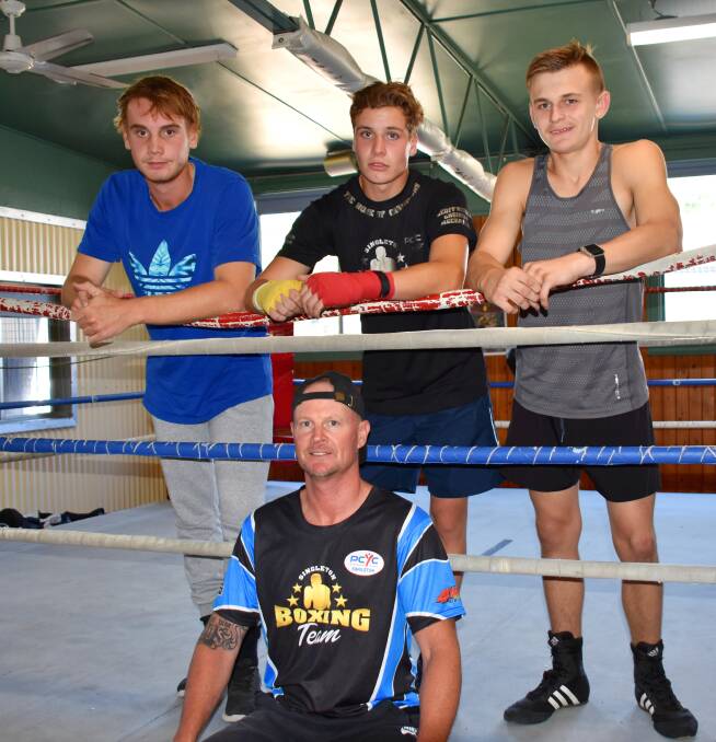 FIGHT NIGHT: Chris Duffie, Cameron King, Jayden Offner and (front) Coach Geoff Nichols. 