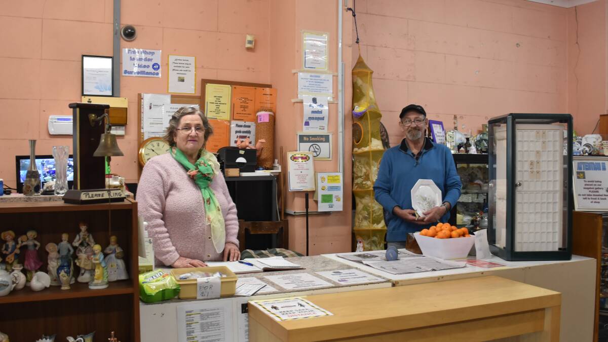 BACK IN BUSINESS: Singleton District Community Op Shop Incorporated workers Barbra Eather and Les Creaser are thrilled to be back at the Op Shop after months of inactivity. 