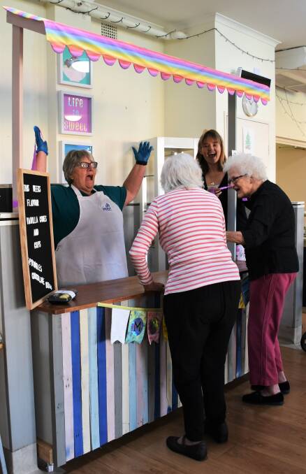 OPEN FOR BUSINESS: Jenny Yates and Leesa Bighen with June Kill and Dawn Eslick cutting the ribbon for the 'McMercy' ice cream stand. 
