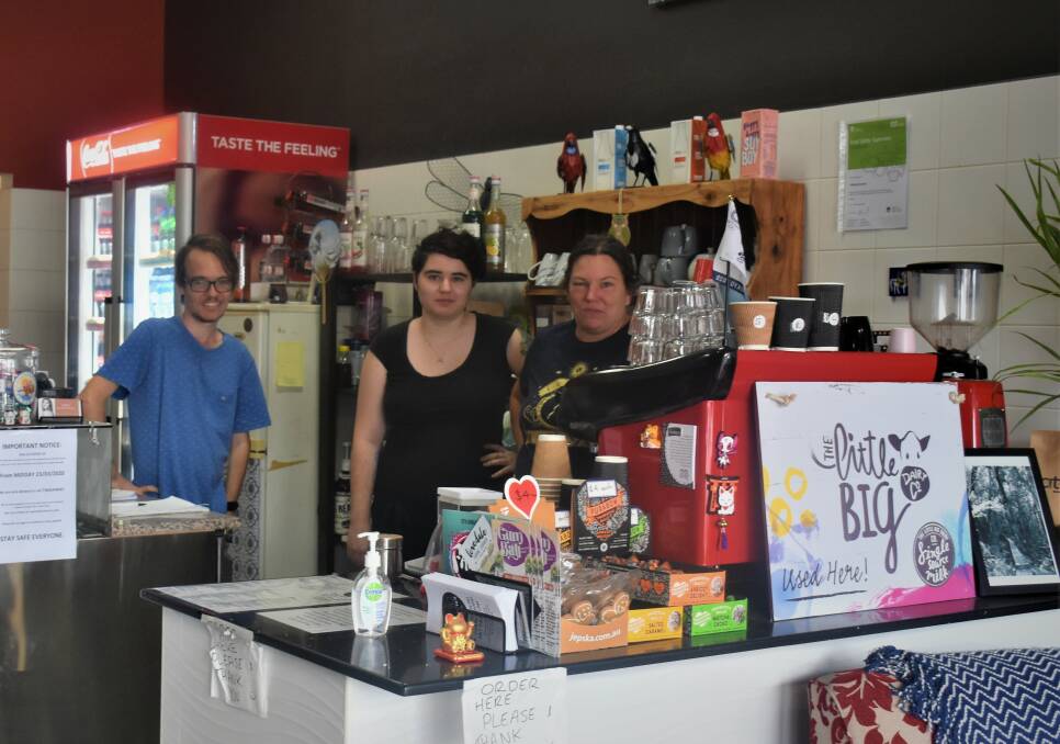 THREE SISTAS: Work experience student and regular customer Mathew Gaskin with Ellie Norman and Rebekah Revie operators of the Three Sista's Cafe on John Street. 