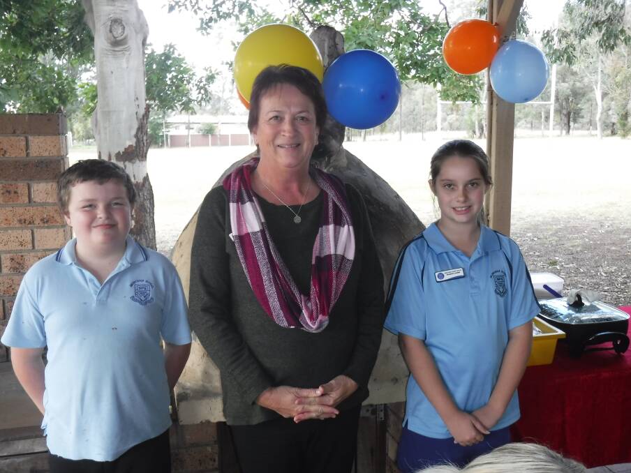 LAST DAY: Milbrodale Public School Leaders James Tomkins and Chanel Ellison with Mrs Margaret Forbes on her last day. 
