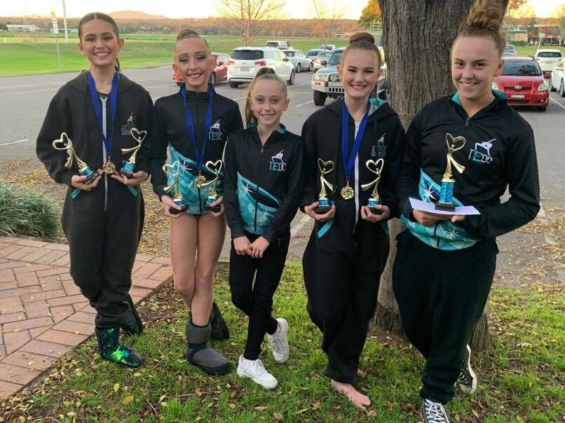 DANCE CREW: The Edge Dance Co with their trophy haul from solos, duos and groups. 