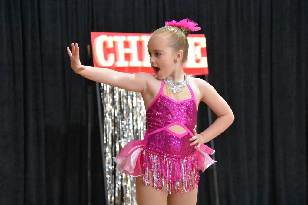 Chloe Sanderson performing a song and tap dance in the under six years section. 