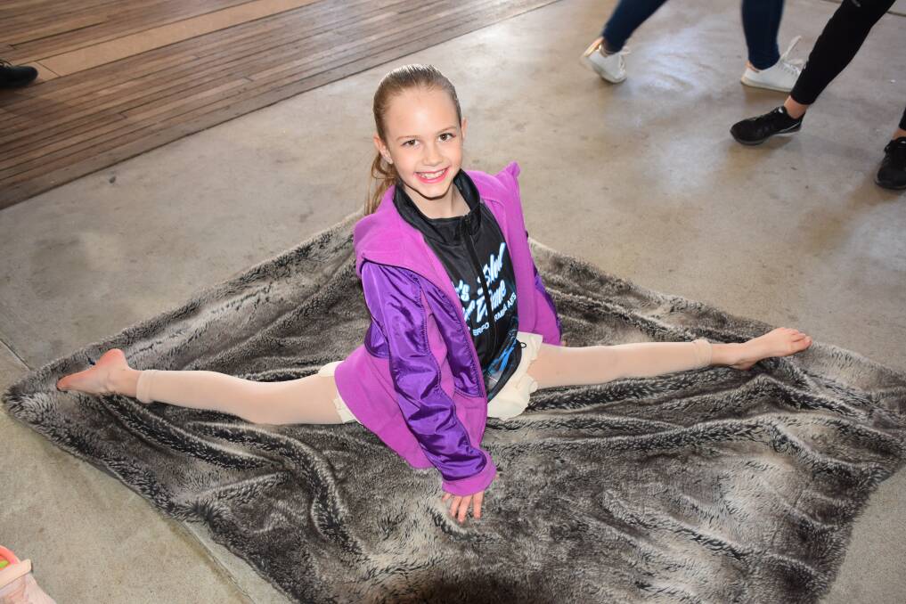 Lilah Sheath from Blu's School of Dance stretching prior to her lyrical solo. 