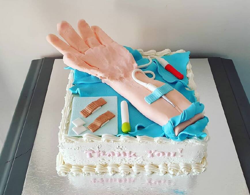 A THANKYOU CAKE: Ms Siggy Staal thanked the nurses and doctors at the Singleton Hospital recently with this cake made my Ali's Treats. 