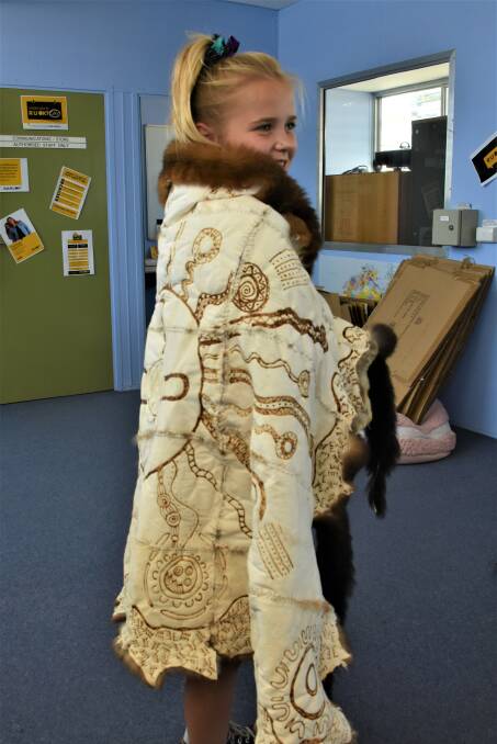 PROUD: Year seven student Shakira showing off the new Possum Cloak. 