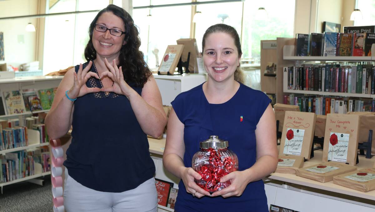 LOVE: Library Marketing and Systems Officer Samantha Watters and Team Leader Library Resources Kylie Tatt. 