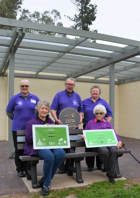 TIDY TOWNS AWARDS: Singleton Tidy Town committee members (back) Diana Thorning, Jack Fleming, Lyn Macbain, (front) Jan Andrews and Betty Searle are thrilled to display the communities awards on the new Museum wall. 