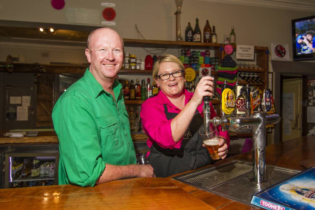 Focused: Armatree Hotel owners Ash and Lib Walker, behind the bar prior to the coronavirus pandemic, are staying positive as they navigate the COVID era. Photo contributed.