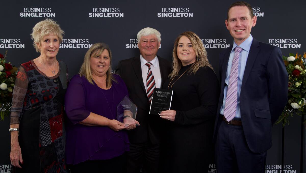ALL SMILES: The Ourcare Services team at the Singleton Business Awards on Friday night where they took out the Business of the Year Award for 2022. Photo supplied. 
