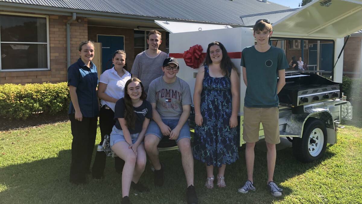St Cath's Year 12 students handing over the "spectacular trailer barbecue".