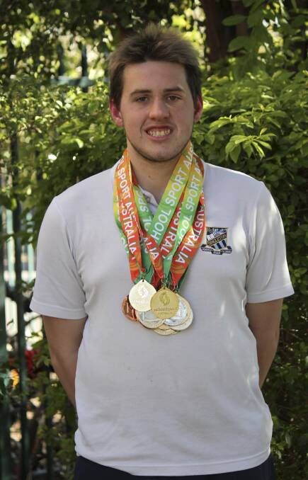 TOP EFFORT: Gilson pictured with his medal haul from Hobart where he scooped the pool.