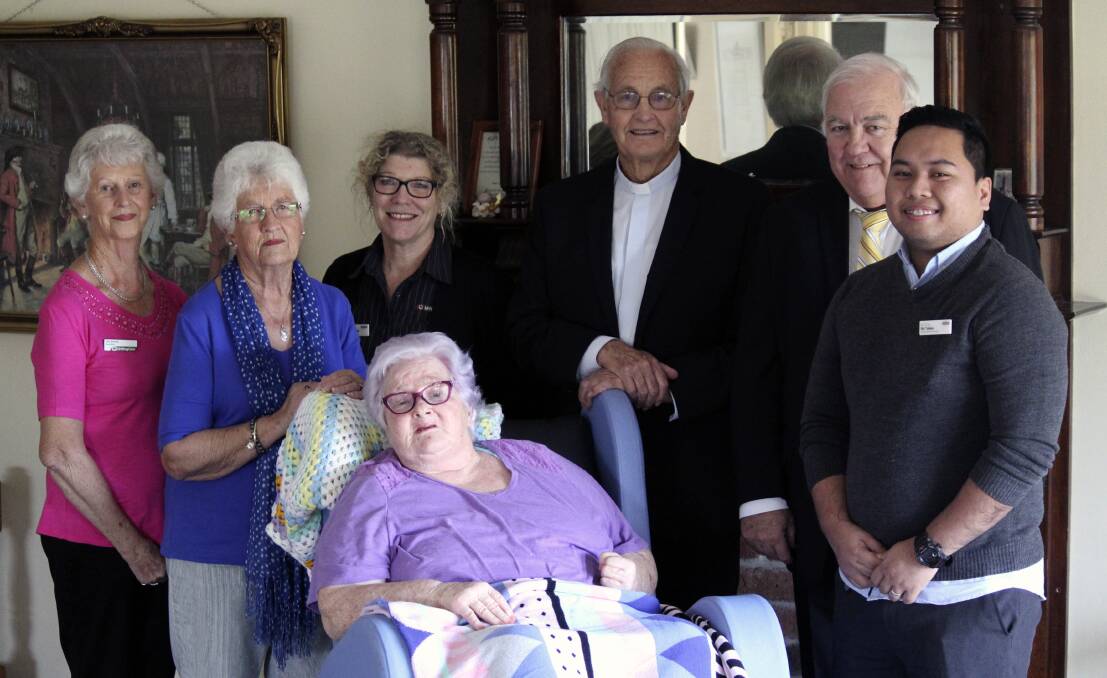 JOINT EFFORT: The Elizabeth Gates auxiliary with assistance from Diggers has purchased the much needed motorised chair which received the tick of approval from resident Annette McDonald when The Argus paid a visit last week.