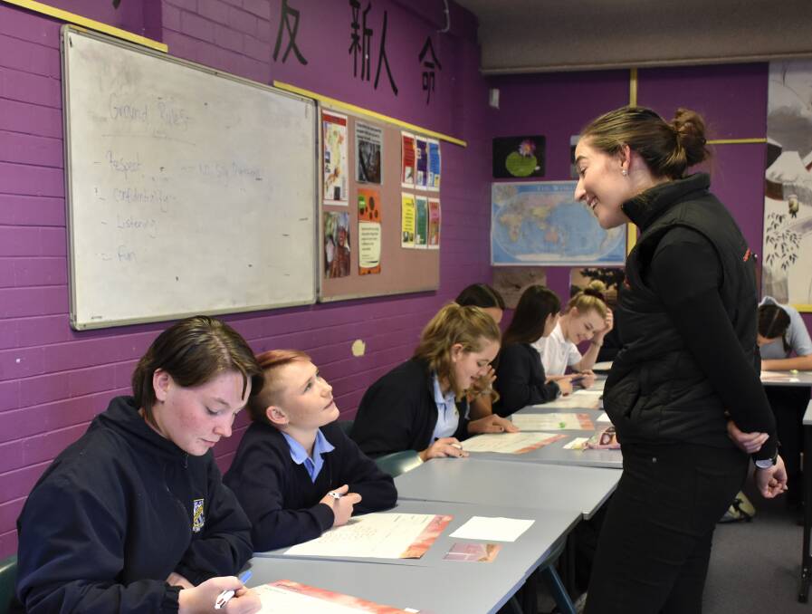 DRIVING CHANGE: Hannah Wandel is a gender equality advocate, public speaker and the founder of Country to Canberra. Pictured here working with students at Singleton High.