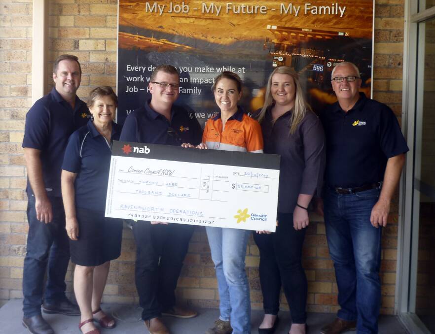 GENEROUS: Ravensworth's environment and community co-ordinator, Laura Barben, presenting the cheque to the Singleton Cancer Council team.
