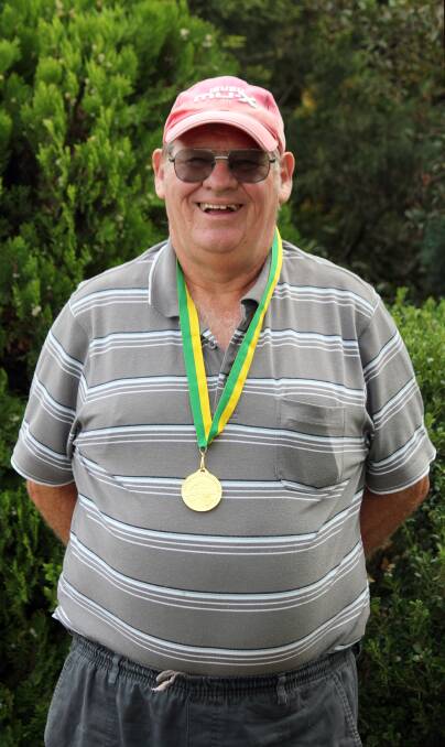 COMPETITIVE: Bruce Smith with his gold medal for the pointscore event.