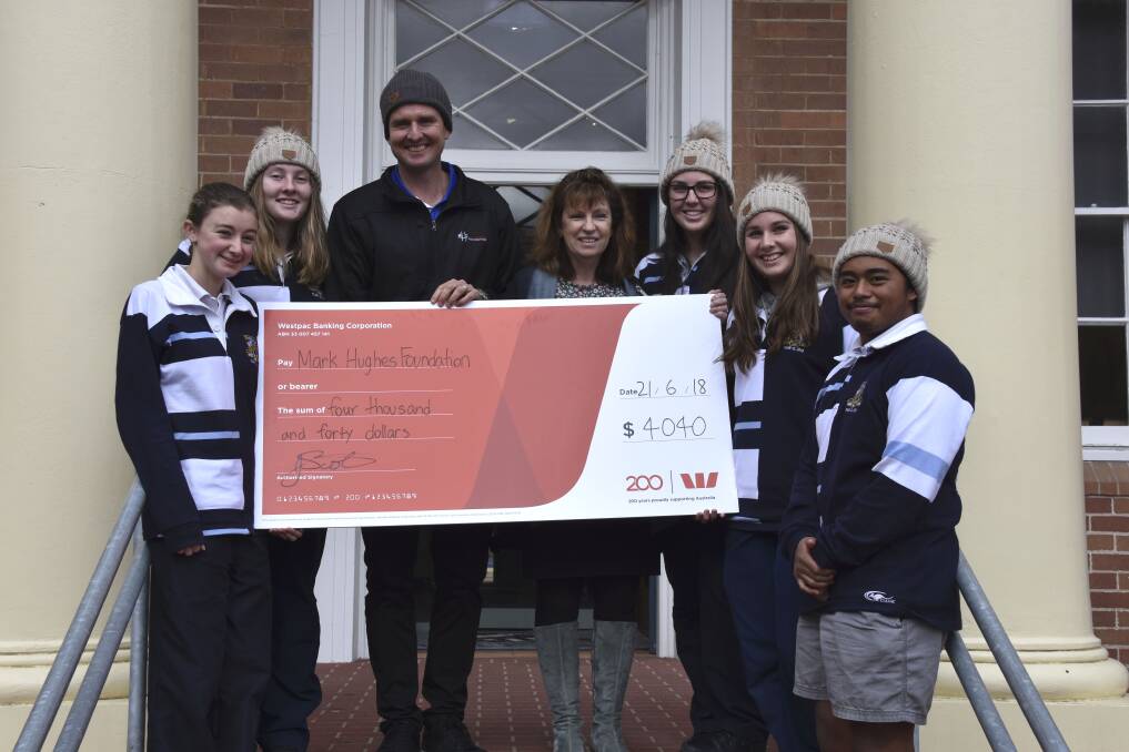 BEANIE DAY: SRC members with Mark Hughes and principal Jo Scott.