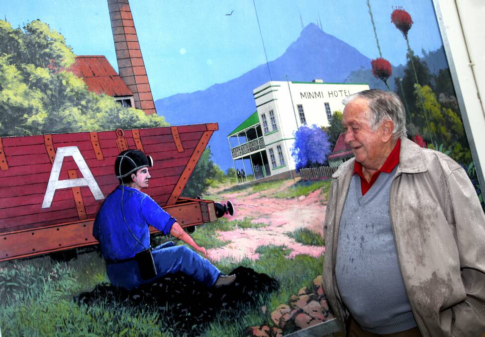 EDUCATION: Bill Freeman in front of his mural at Minmi Public School in late 2010.
