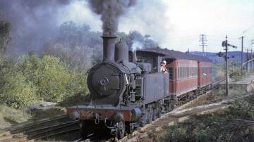 ALL ABOARD: A steam train pulling passenger carriages leaves Redhead station in 1963. Picture: Courtesy, Ray Love 