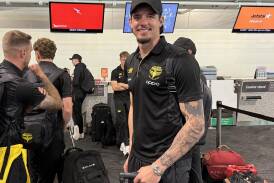 Phoenix forward Oskar Zawada all smiles at Wellington Airport ahead of their trip to Newcastle. (Ben McKay/AAP PHOTOS)