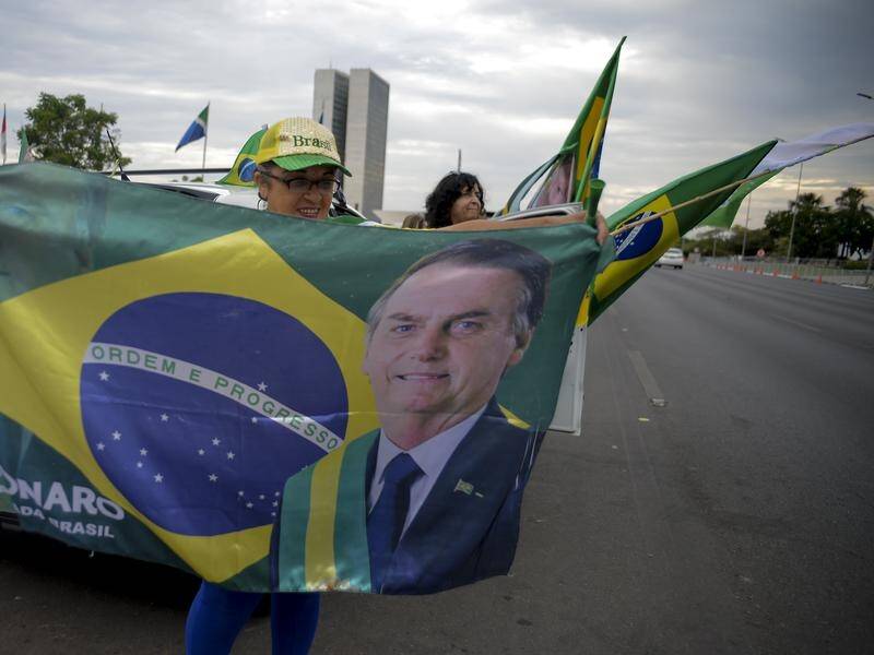 Brazilian President Jair Bolsonaro has taken the lead in early counting in the country's election. (AP PHOTO)