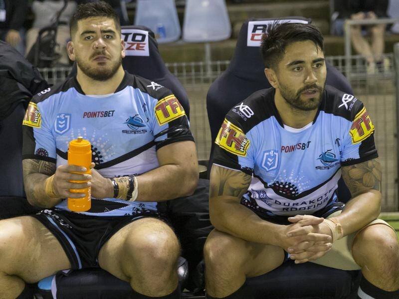 Shaun Johnson (r) was benched in the closing stages of Cronulla's NRL loss to Brisbane.