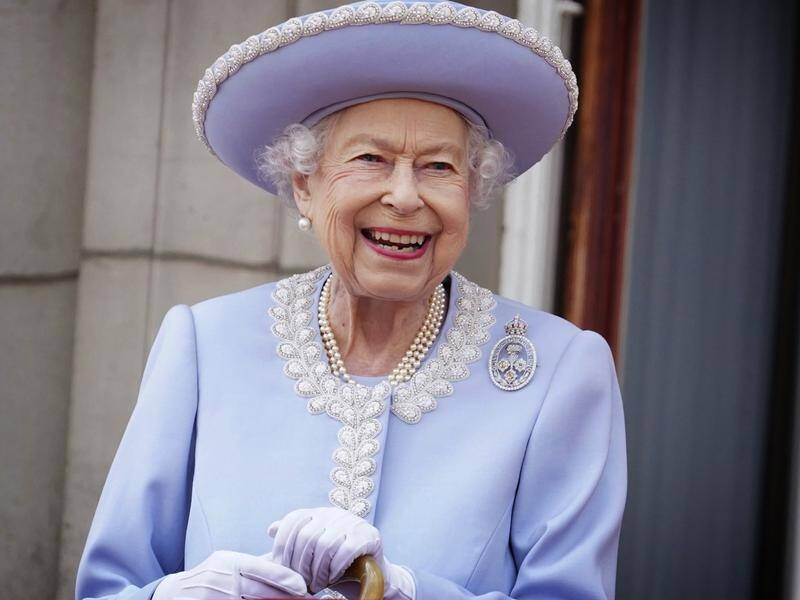 Queen Elizabeth smiles from the balcony of Buckingham Palace at her Jubilee celebrations.