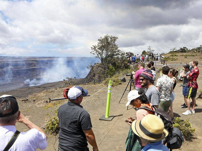 Thousands of tourists are flocking to a national park in Hawaii to see the Kilauea volcano erupt. (AP PHOTO)