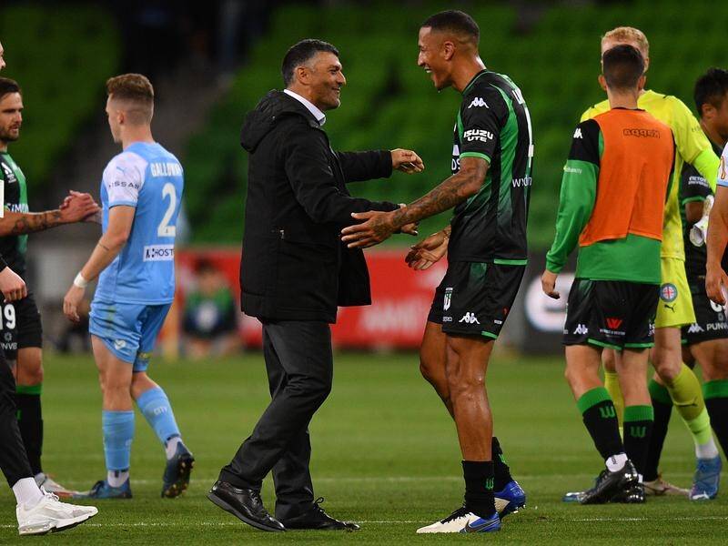 Western coach John Aloisi celebrates their win over Melbourne City with defender Leo Lacroix.