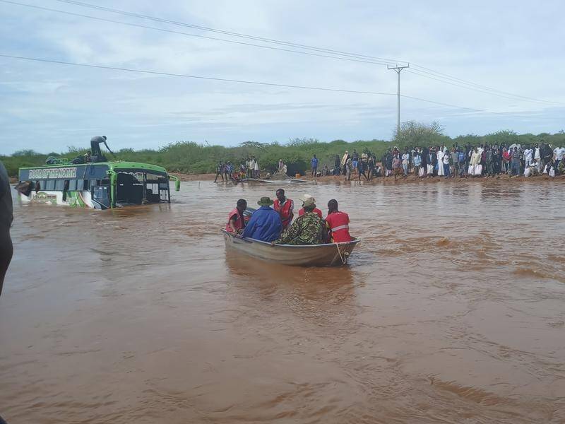A bus carrying 51 passengers was swept away as floods bring death and displacement in Kenya. (AP PHOTO)