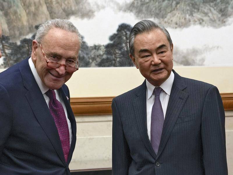 US Senate Leader Chuck Schumer has met with Chinese Foreign Minister Wang Yi in Beijing. (AP PHOTO)