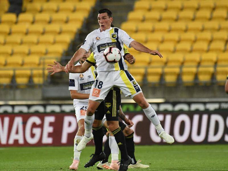 Central Coast's Matthew Millar holds up the ball in the 2-0 defeat to the Phoenix in Wellington.