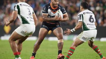 Thomas Mikaele (c) has been released by NRL club Wests Tigers to join a Super League club.