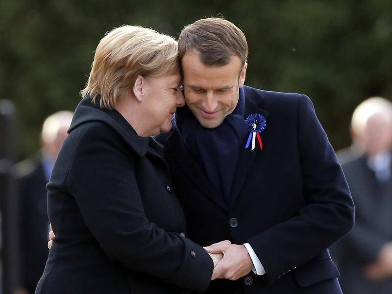 Emmanual Macron has paid tribute to "dear Angela" Merkel as she steps down as German chancellor.