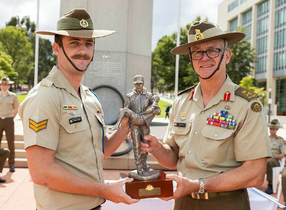 Chief of Army, Lieutenant General Rick Burr presents Corporal Quinn Jensen (left) with the Jonathon Church Good Soldiering Award in Canberra. Picture: supplied by the Army